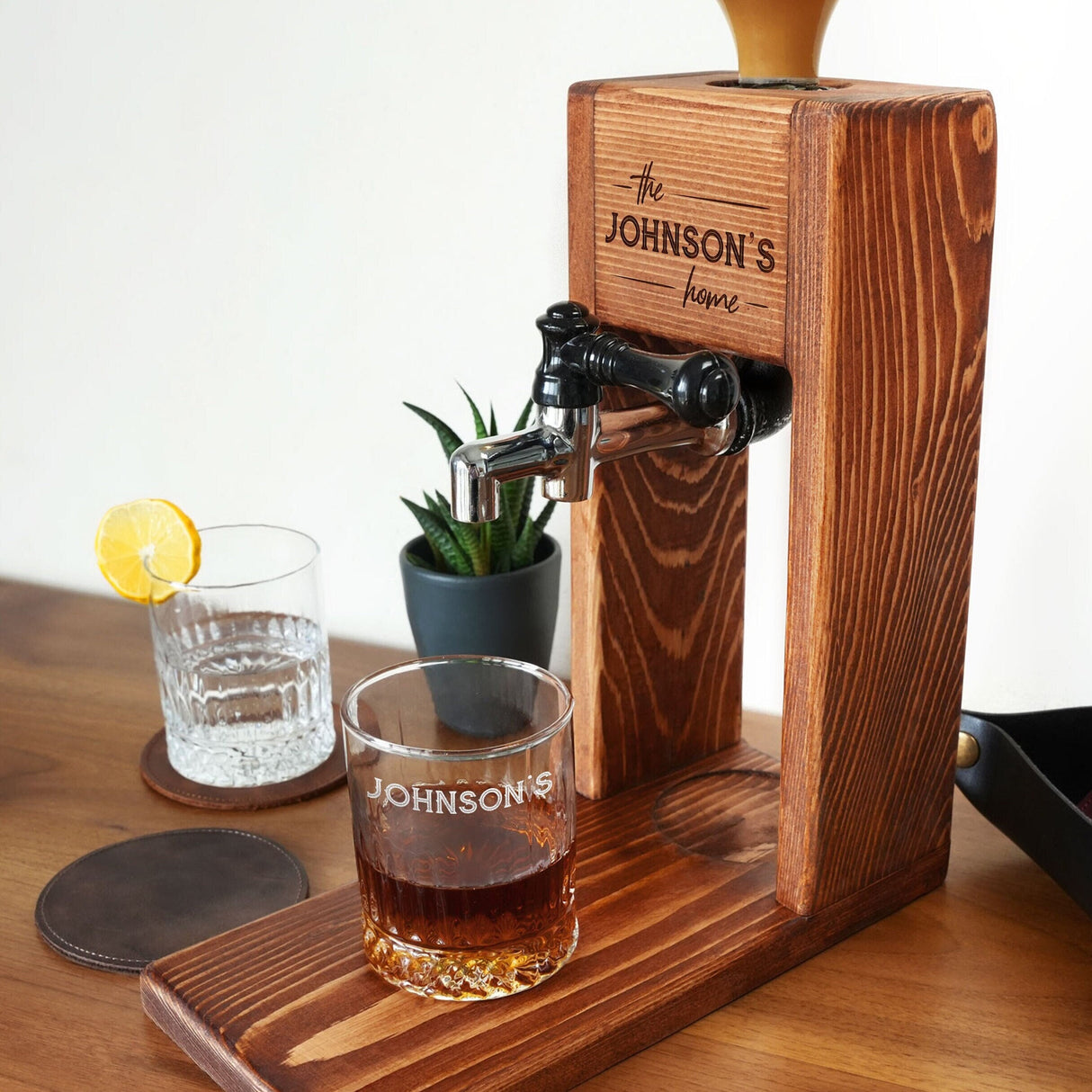 a drink dispenser sitting on a wooden table