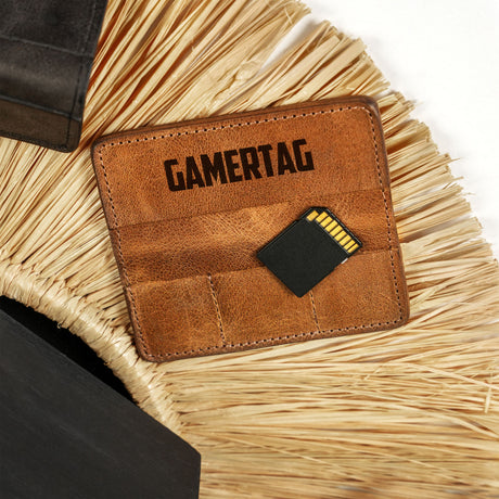 a brown leather wallet sitting on top of a wicker chair