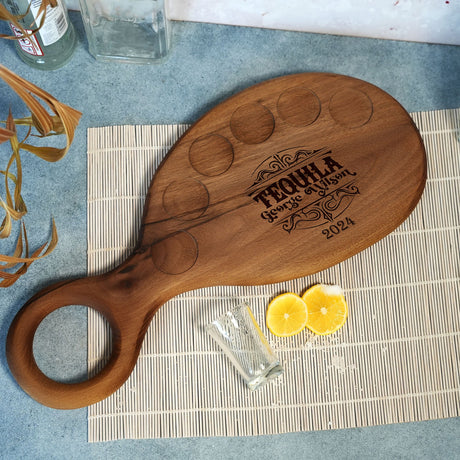 a wooden cutting board sitting on top of a table