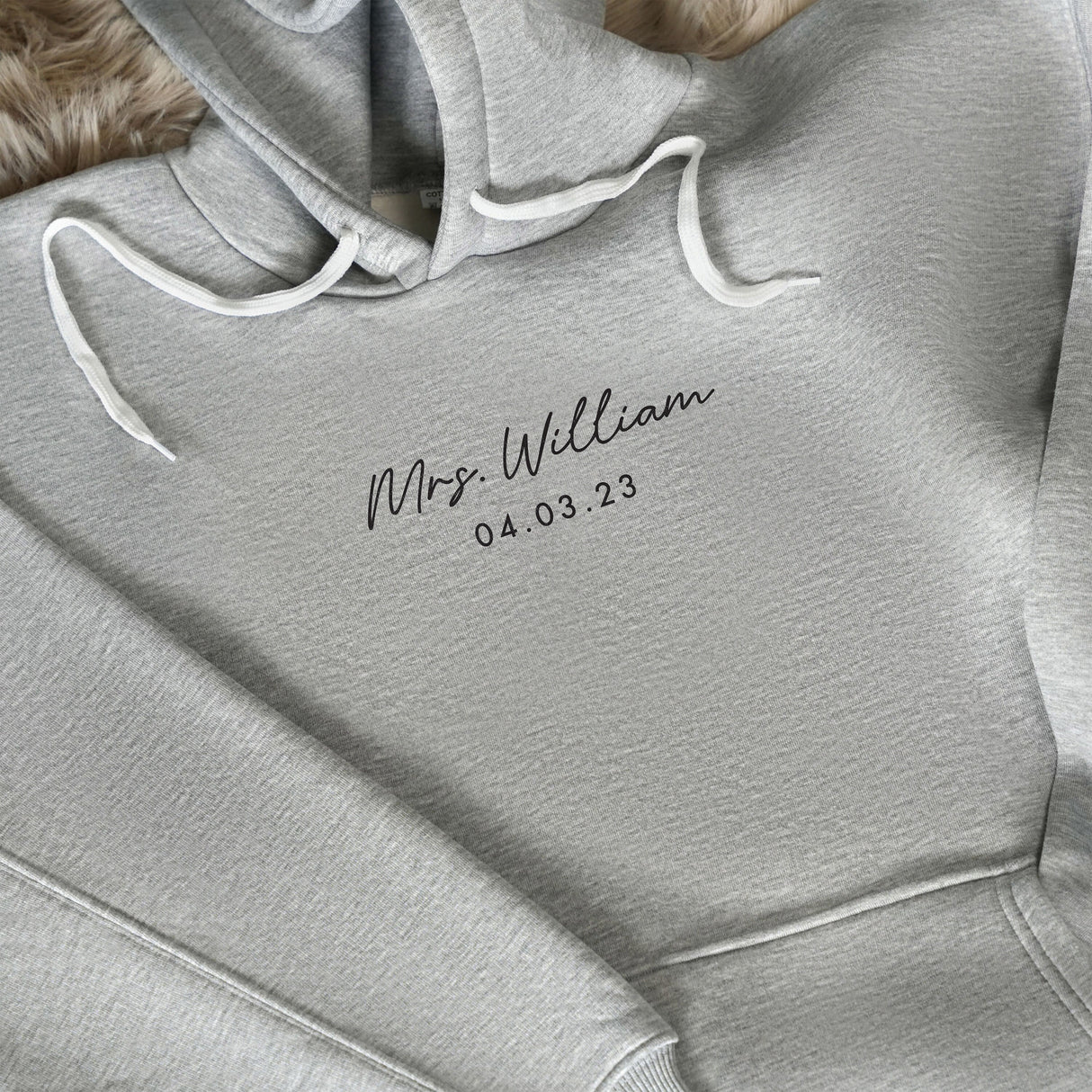 a close up of a hoodie with the name of a person on it