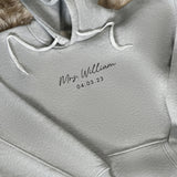 a close up of a hoodie with the name of a person on it