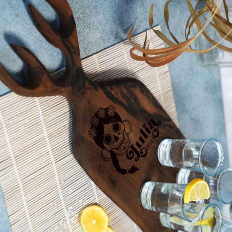 a wooden cutting board with a design on it