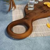 a wooden cutting board with lemon slices on it