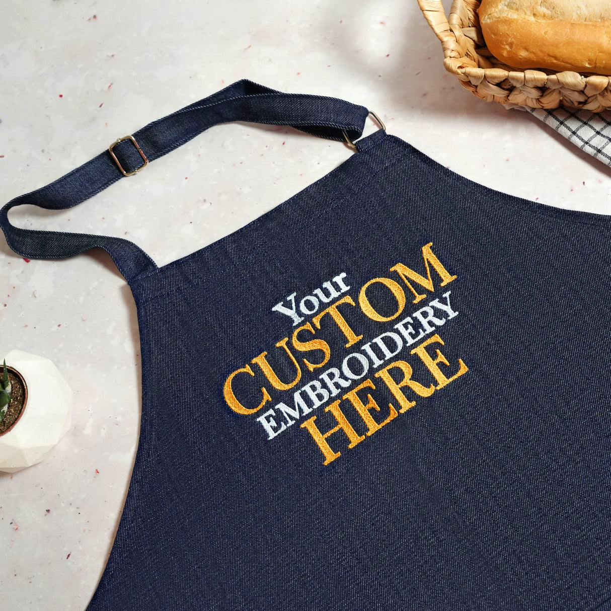 a blue apron with a custom message on it