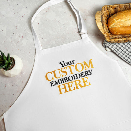 a white apron that says your custom embroidery here