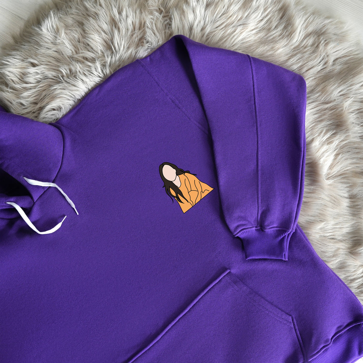 a purple hoodie with a picture of a woman&#39;s face on it