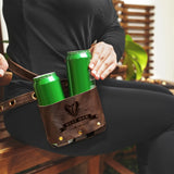 a woman sitting on a bench holding two green cans