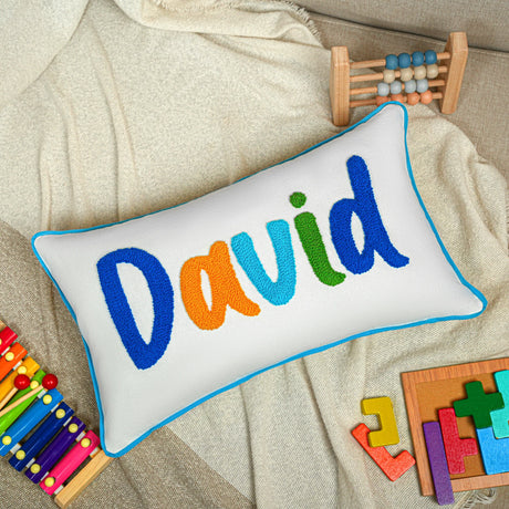 a white pillow with the word david on it