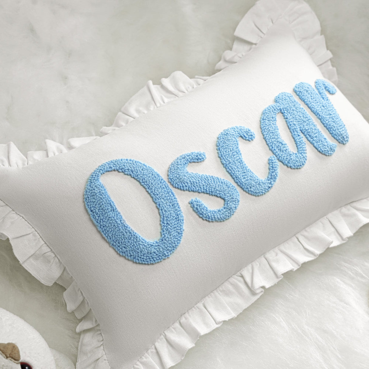 a pillow with the word oscar on it