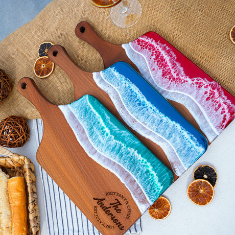 a couple of cutting boards sitting on top of a table