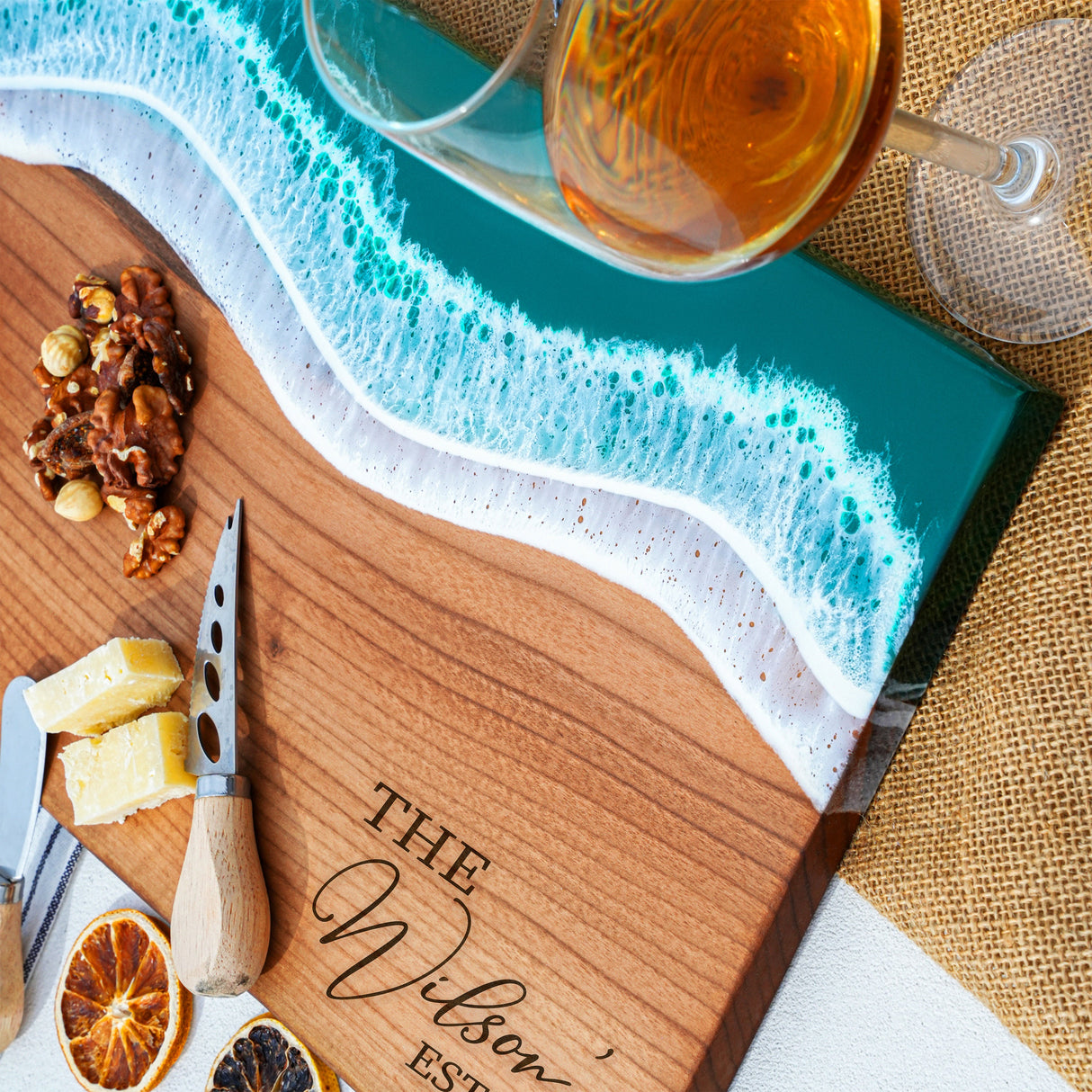 a cutting board topped with sliced oranges and nuts