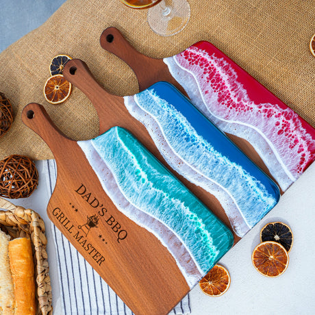 a couple of cutting boards sitting on top of a table