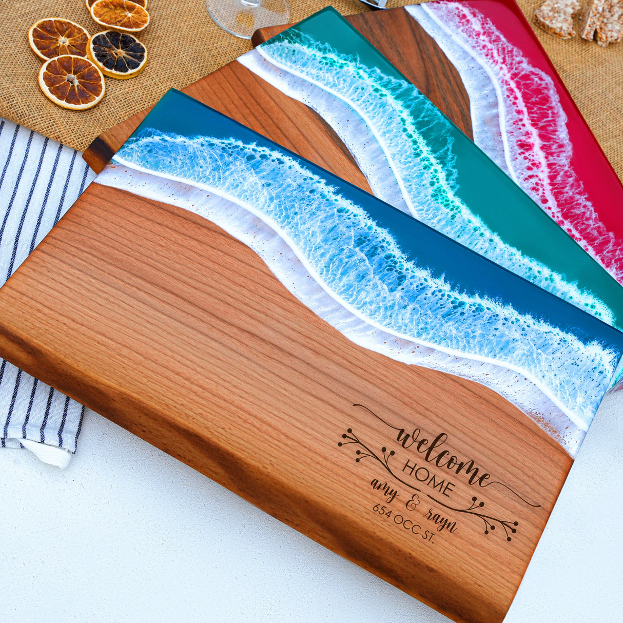 a couple of cutting boards sitting on top of a table