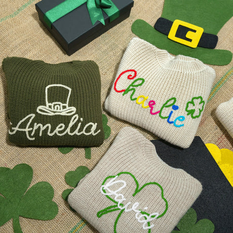 a group of sweaters and hats sitting on top of a table