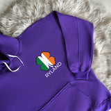 a purple hoodie with a shamrock on it