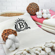 a white towel with a monogrammed b on it