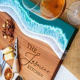 a cutting board with a knife, oranges, and nuts on it