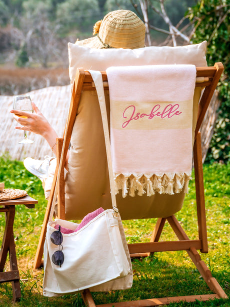 a woman sitting in a chair holding a glass of wine