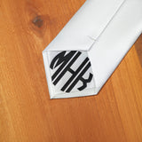 a close up of a tie on a wooden surface