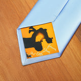 a blue tie with a picture of a dog on it