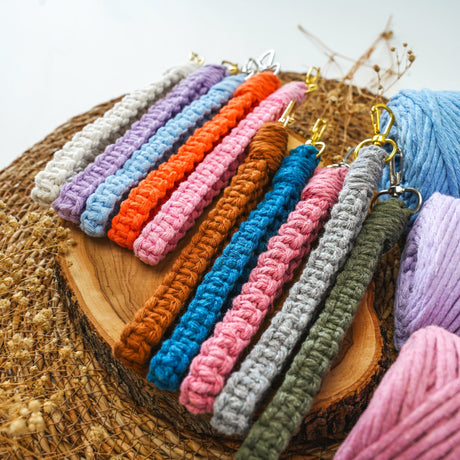 a close up of a bunch of yarn on a piece of wood