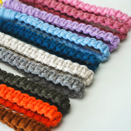 a row of crocheted hair ties sitting on top of a table