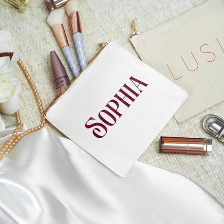 a table topped with lipstick and other makeup items