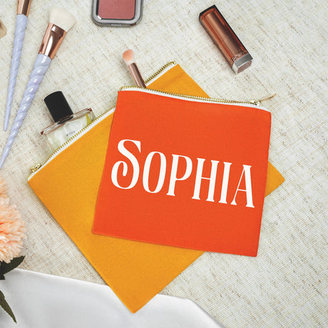 a small orange bag with the word sophia on it