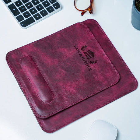 a leather mouse pad sitting on top of a desk