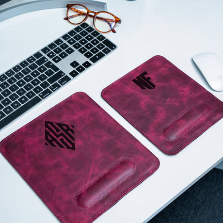 a pair of mouse pads sitting on top of a desk