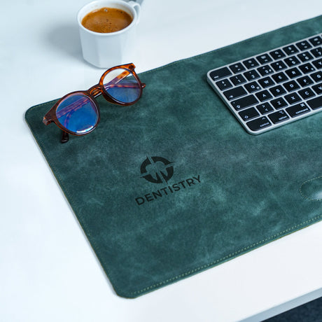 a pair of glasses sitting on top of a mouse pad