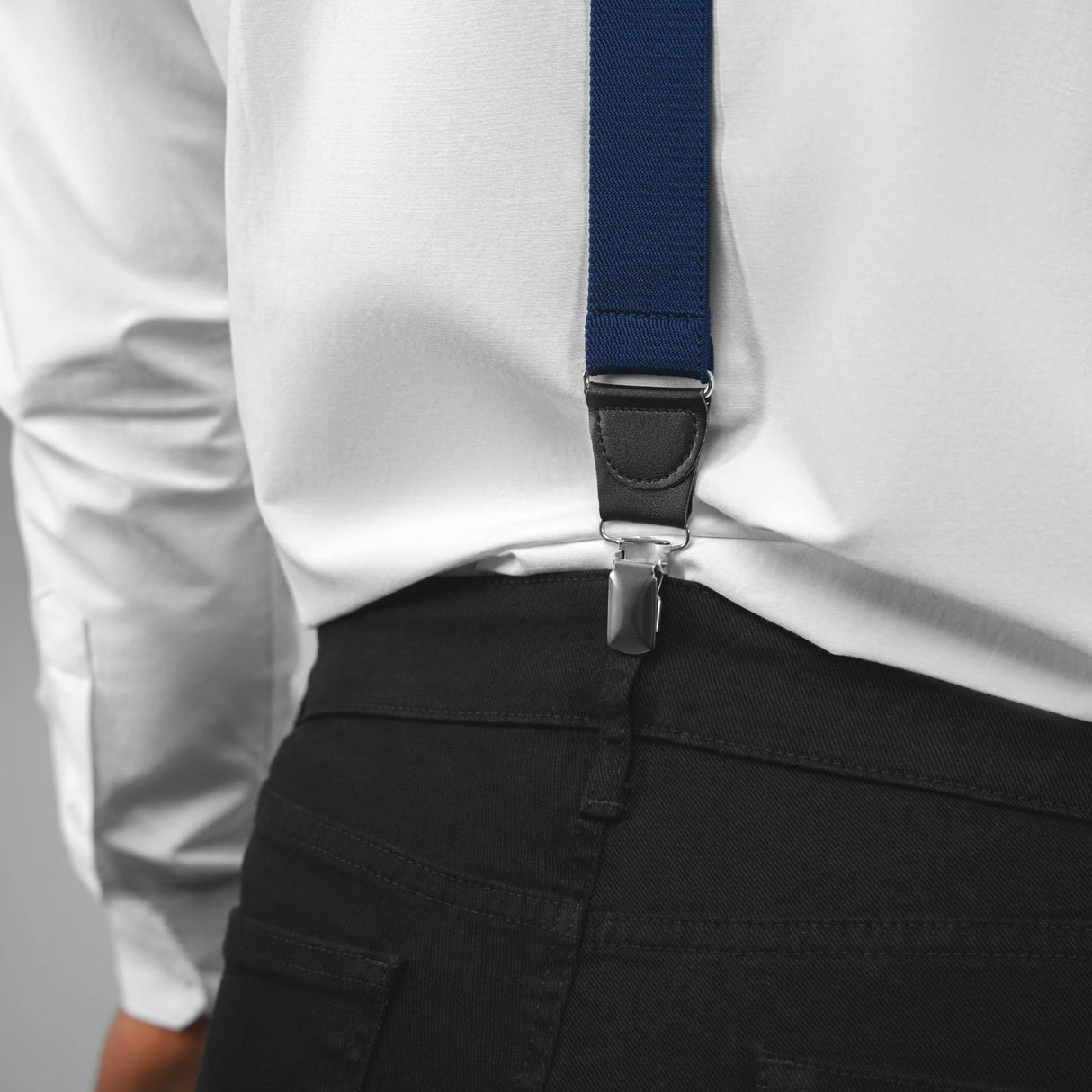 a man wearing a white shirt and a blue tie