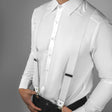 a man wearing a white shirt and suspenders