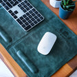 a keyboard and mouse pad on a table