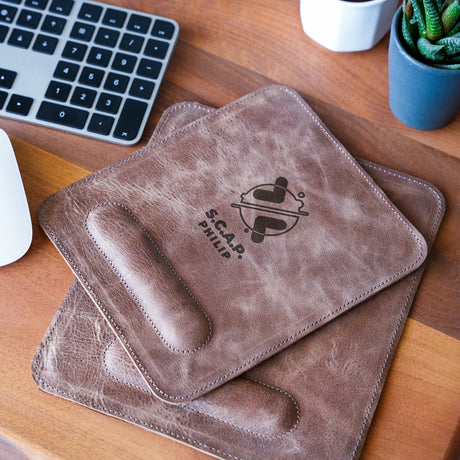 two coasters on a desk with a keyboard and mouse