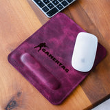 a computer mouse and a mouse pad on a desk