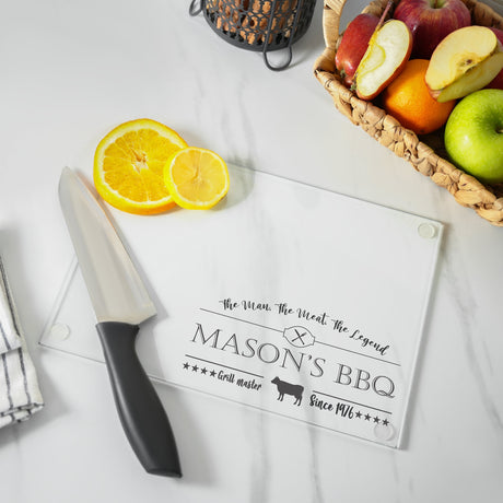 a cutting board with a knife on it next to a basket of fruit