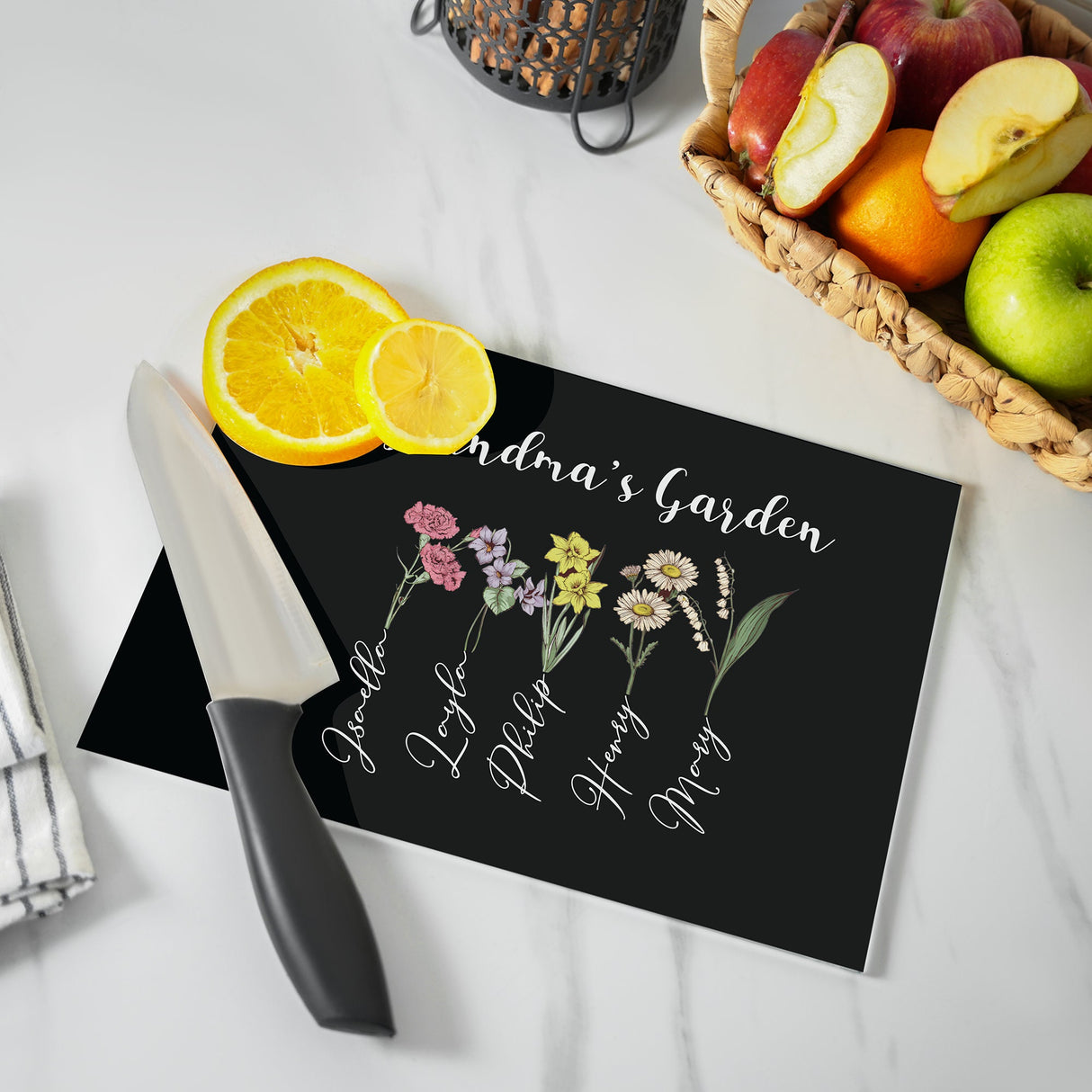 a cutting board with flowers and fruit on it