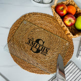 a table with a basket of apples and a knife