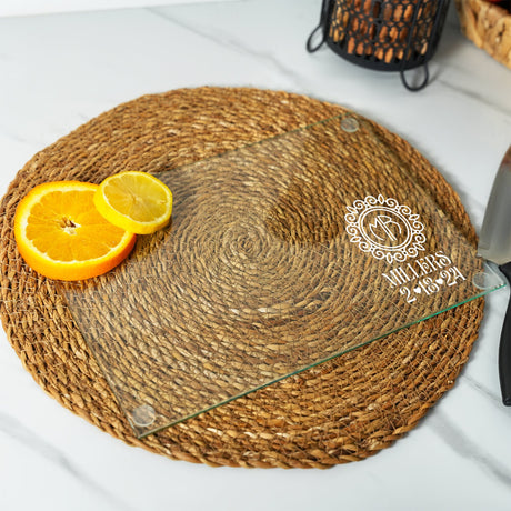 a glass plate with a slice of orange on it