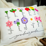 a pillow that has a bunch of flowers on it