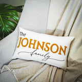 a white pillow with the name of a family on it