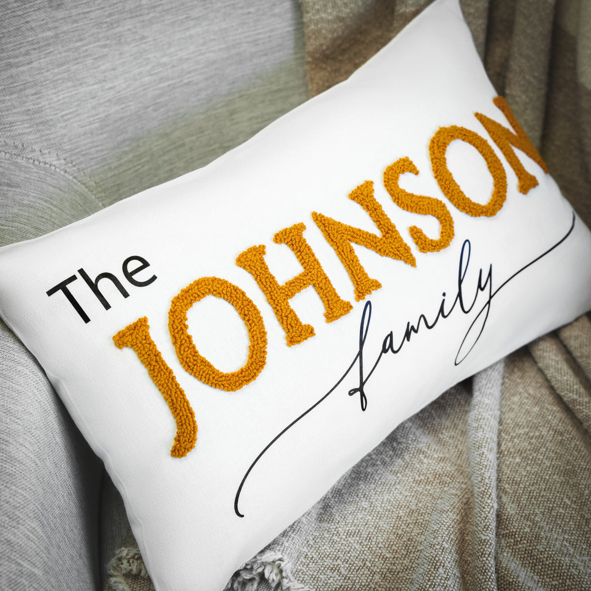 a pillow with the name of a family on it