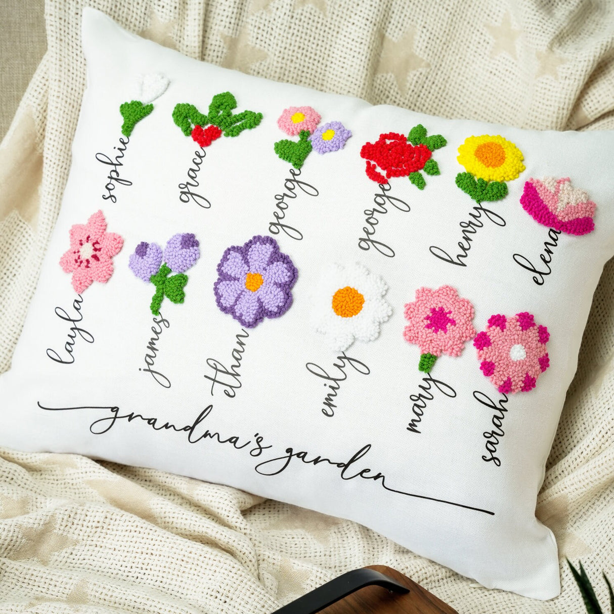 a white pillow with a bunch of flowers on it