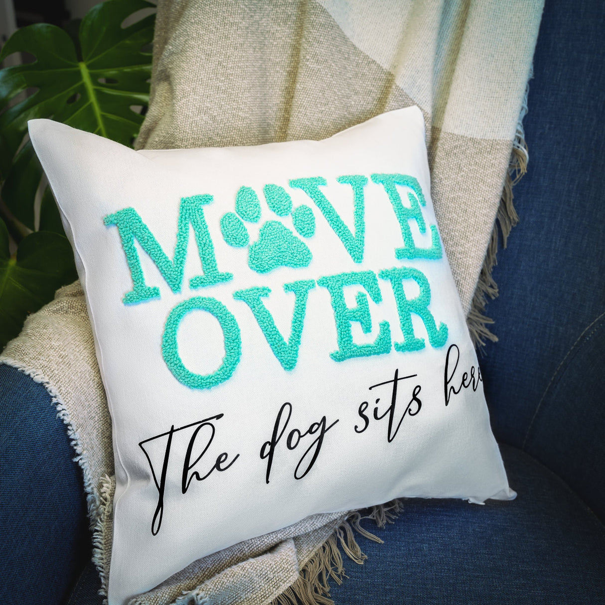 a pillow that says move over the dog sits here