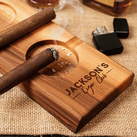 a wooden cigar holder with a cigar on it