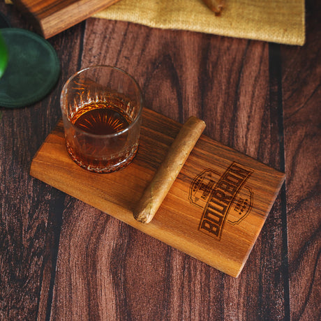 a wooden coaster with a glass of alcohol on it