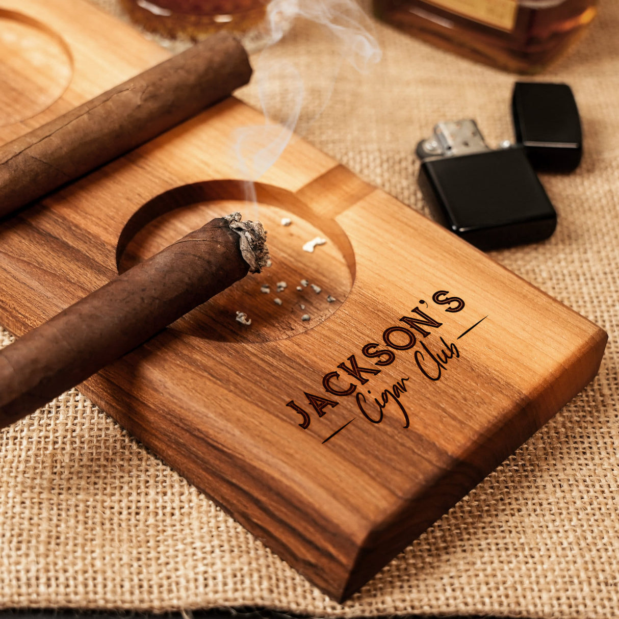 a wooden cigar holder with a cigar on it