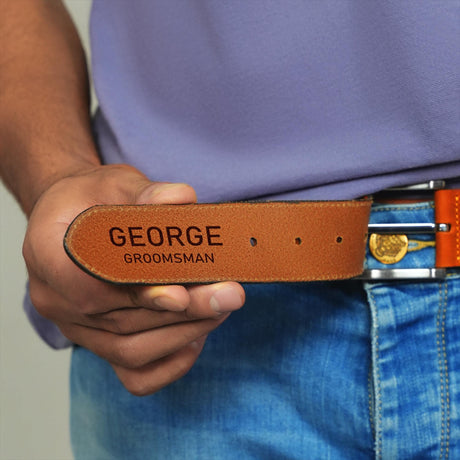 a man wearing a belt with a name tag on it