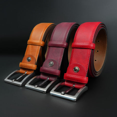 a group of three belts sitting next to each other